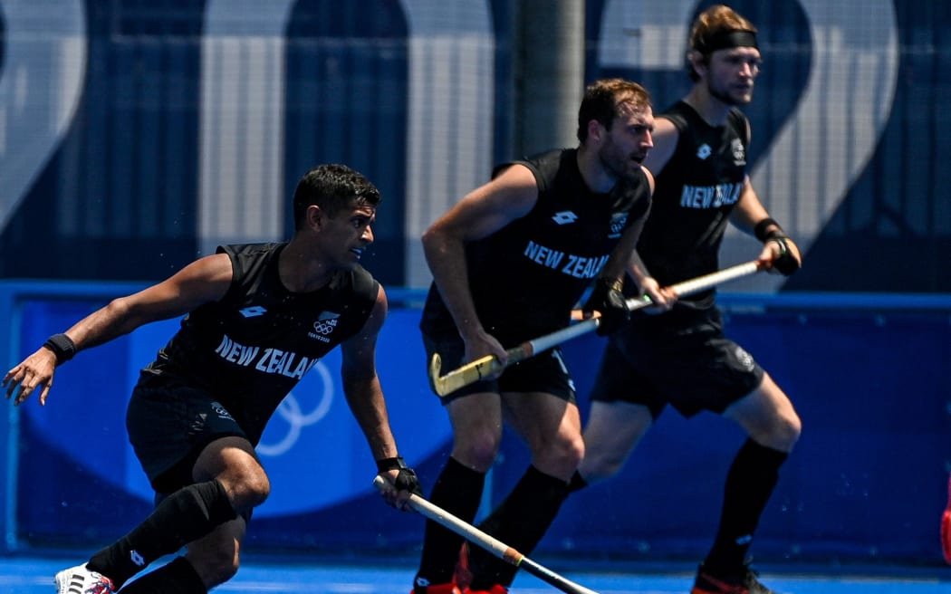 New Zealand Black Sticks men's team in action on the pitch